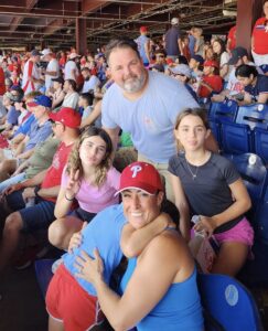Members of Rittenhouse Psychiatric Associates' team pose for a photo at a Phillies baseball game.